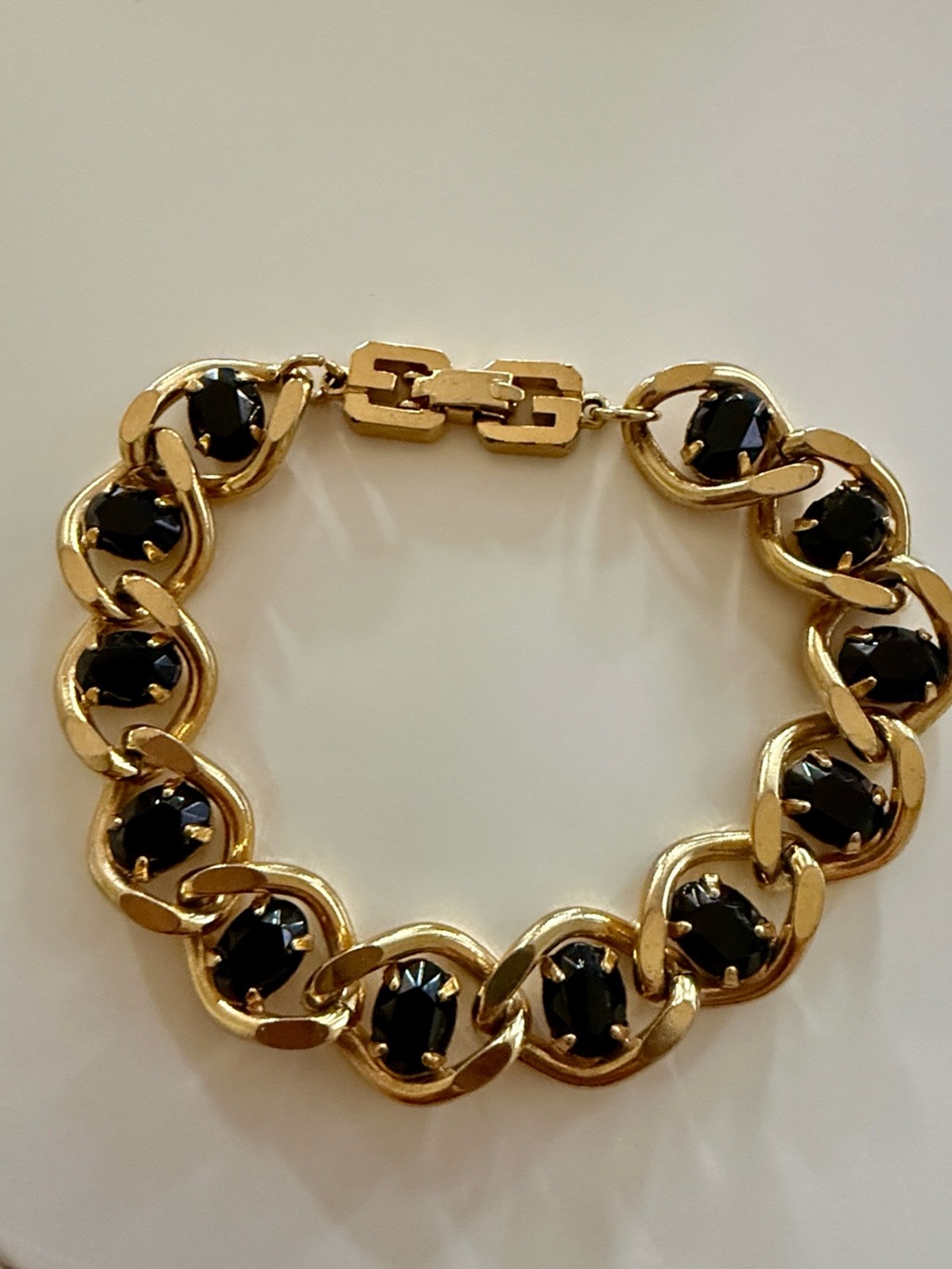 Vintage Givenchy gold-plated twisted link bracelet prongset black glass cabochon